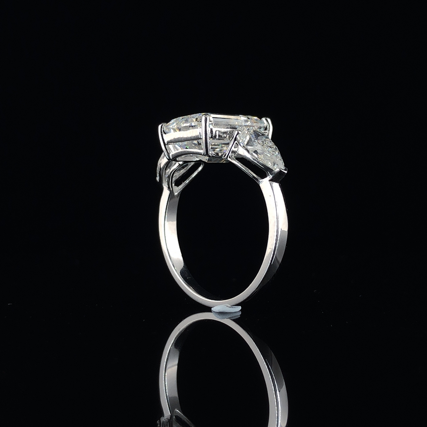 Emerald And Pear Cut Diamond Halo Three Stone Engagement Ring